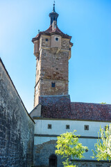 Poster - Vertical of Medieval Klingentor tower in Rothenburg ob der Tauber (Germany) against blue sky