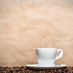 Poster - Closeup of a white cup with steam on coffee beans against a beige background with copyspace