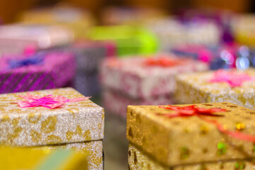 Canvas Print - Closeup shot of colorful jewelry boxes on a blurred background