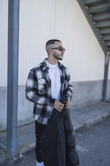 Wall Mural - Vertical shot of a Caucasian man posing for a photo