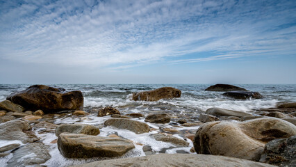 Sticker - Beautiful photo of beach with pebbles, cliff, sea and cloudy sky