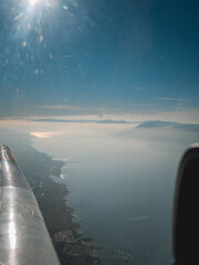 Sticker - Vertical shot of a water landscape seen from an airplane