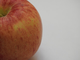 Wall Mural - Closeup of a healthy red apple isolated on a white background