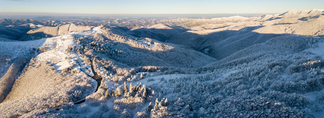 Sticker - Serene landscape of the snow covered Shipka summit in Bulgaria at sunset