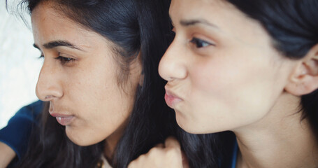 Sticker - Closeup shot of Beautiful young two friends South Asian girls sitting and posing by their mouses