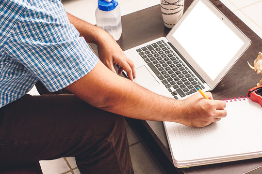 home Office. notebook, school supplies. I work at home at a table. Working from home. Desk with notebook, camera, cell phone, bookmark, book.