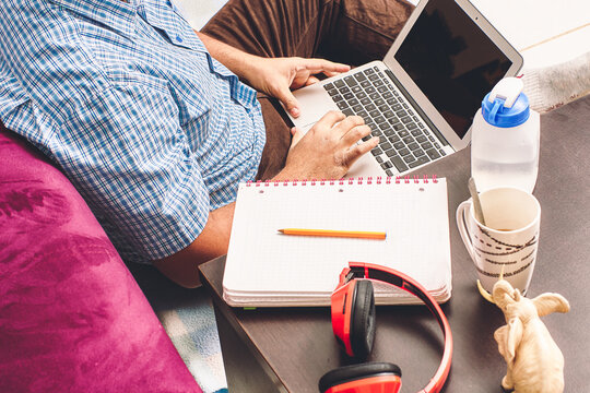 home Office. notebook, school supplies. I work at home at a table. Working from home. Desk with notebook, camera, cell phone, bookmark, book.