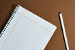 © oaxe - home Office. notebook, school supplies. I work at home at a table. Working from home. Desk with notebook, camera, cell phone, bookmark, book.