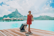 Luxury Bora Bora Travel Vacation Cruise Ship Passenger Tourist Arriving At Port Of Call Harbour In Bora Bora Island, Tahiti, French Polynesia With Luggages. Woman On Paradise Getaway Beach Hotel.