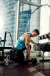 © Georgii - Athletic man shakes his biceps with dumbbell in his hands. Healthy lifestyle concept