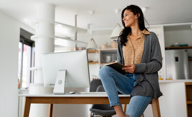 Happy beautiful woman using technology device to work, study at home. Social media time.