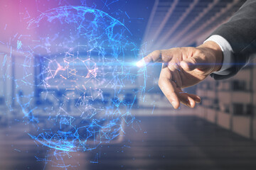 Poster - Close up of businessman hand pointing at abstract glowing polygonal sphere on blurry office interior background. Technology and cyber concept. Double exposure.