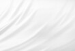 © SappawatS - Close up of white silk textured cloth background. Smooth elegant white silk or satin luxury cloth texture can use as wedding background. Luxurious background design. White fabric texture background.
