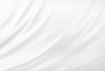 Close up of white silk textured cloth background. Smooth elegant white silk or satin luxury cloth texture can use as wedding background. Luxurious background design. White fabric texture background.