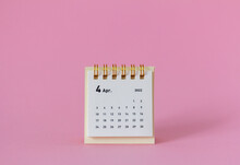 Desktop Calendar For April 2022 On A Pink Background.