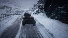 A Militarised Atmosphere With Tanks In Winter Conditions. A Winter Mountain Military Road Covered With Snow. The Animation Is Perfect For Backgrounds About War, Military Vehicles And Militarism