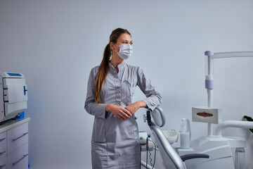 Wall Mural - Portrait of a caucasian female dentist in her office