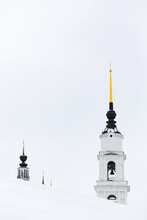 A Minimalistic Shot Of An Orthodox Stone White Cathedral With Black Cupolas And Golden Bright Yellow Crosses On Top