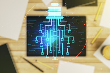 Poster - Creative light bulb illustration with microcircuit and modern digital tablet on desktop on background, top view, future technology concept. Multiexposure