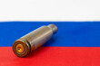 Cartridge case on Russian flag close-up. Russia is the aggressor country.