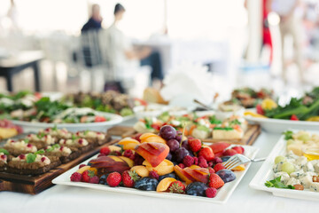 Wall Mural - Variety of dishes on the banquet table in the restaurant