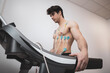 ©  Yistocking - A young athlete undergoes a stress test on a treadmill.It measures the activity of the heart with an electrocardiogram.