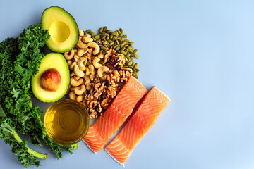 Wall Mural - Overhead View of Fresh Omega-3 Rich Foods: A variety of healthy foods like fish, nuts, seeds, fruit, vegetables, and oil rich in omega-3 nutrients