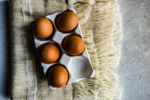 Overhead View Of Eggs In A Ceramic Egg Carton