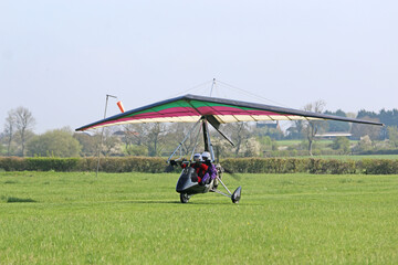 Poster - Ultralight airplane taxiing on a farm strip	