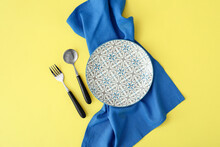 Simple Table Setting On Yellow Background