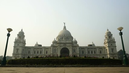 Wall Mural - Timelapse video of Victoria Memorial view, large marble building in Central Kolkata, The British made memorial lies on the Maidan and is one of the famous monuments of Kolkata, West Bengal, India.