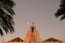 Church Tower With Palm Leaf And Moon On Genoa, Liguria In Italy.