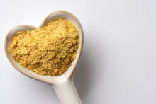 Nutritional Yeast On A Heart Shaped Spoon