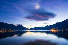 Alpine Lake Maggiore With Mountain And Moon Light In Dusk In Ascona, Switzerland.