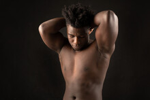 Portrait Of An African Male With Muscles On A Black Background