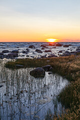 Wall Mural - Sunset over the Baltic sea. Rocky shore of Purekkari neem, the Northernmost location of Estonian mainland