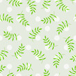Seamless pattern with dots and green leaves