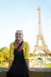 © Stigur/peopleimages.com - Making holiday memories. An attractive young woman sight seeing in the Paris.