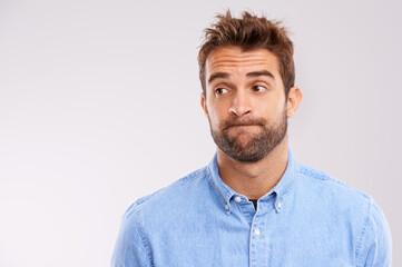 Poster - Uhhhmm.... A studio shot of a handsome man making a face.