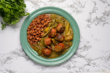 Wall Mural - Chorizo stew with green sauce and nopal cactus. Mexican food