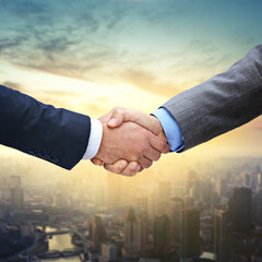 Aufkleber - Taking the city by storm. Shot of two businessmen shaking hands.