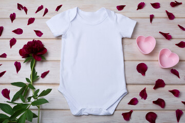 Wall Mural - White baby short sleeve bodysuit mockup with pink hearts two pink hearts, maroon peony and petals 