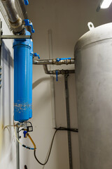 Wall Mural - Two sludge filters on the compressed air supply.