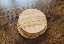 Blank Coaster Stack Mockup With Wood Texture On Wooden Surface. Circular Drink Pad Pile Template