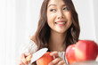 © Shutter B - Healthy lifestyle, Close up beautiful young asian woman holding apple with smiling happy. Healthy eating, Food and lifestyle, Health, Beauty, Dieting concept.