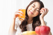 © Shutter B - Healthy lifestyle, Close up beautiful young asian woman with fruit juice smiling happy. Healthy eating, Food and lifestyle, Health, Beauty, Dieting concept.