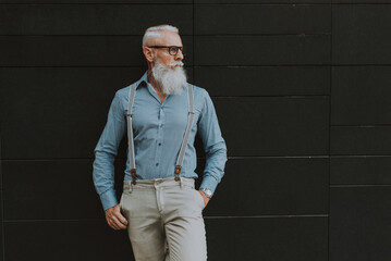 Cool Senior hipster man with stylish beard. Modern business man urban portraits outdoor. Conceptual  representation of aging as a state of mind