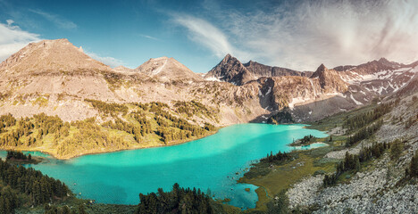 Canvas Print - Atmospheric and moody aerial drone point of view of turquoise Krepkoe Lake at sunset. National park and natural wonders background