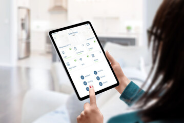Aufkleber - Woman use smart home automatization app for monitoring and control home devices concept