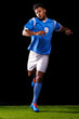 © D M/peopleimages.com - Lets play. Full length studio shot of a handsome young soccer player isolated on black.
